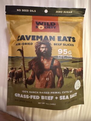 Caveman eats air-dried beef slices